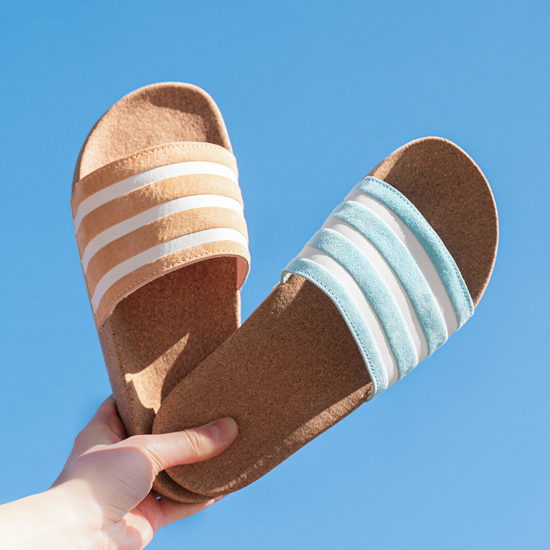 The adidas Adilette "Cork" in Acid Orange and Hazy Sky will keep you company all summer long