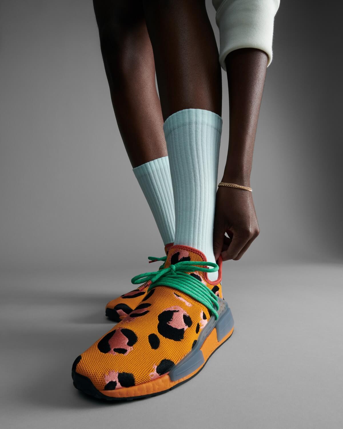 on feet - adidas Originals x Pharrell Hu NMD Animal Print - Focus Orange / Core Black / Screaming Green - GZ4439