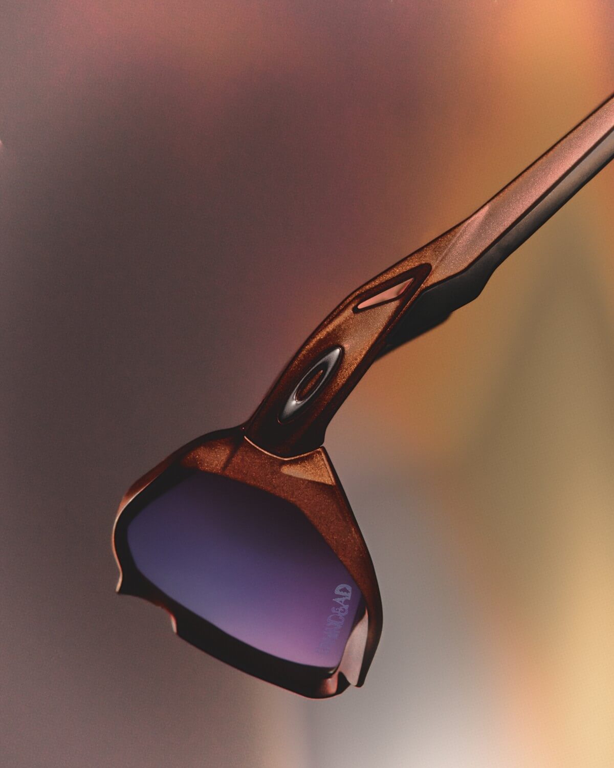Oakley Factory Team x Brain Dead "Rare Metals" - Team Plazma Orange Prizm Violet