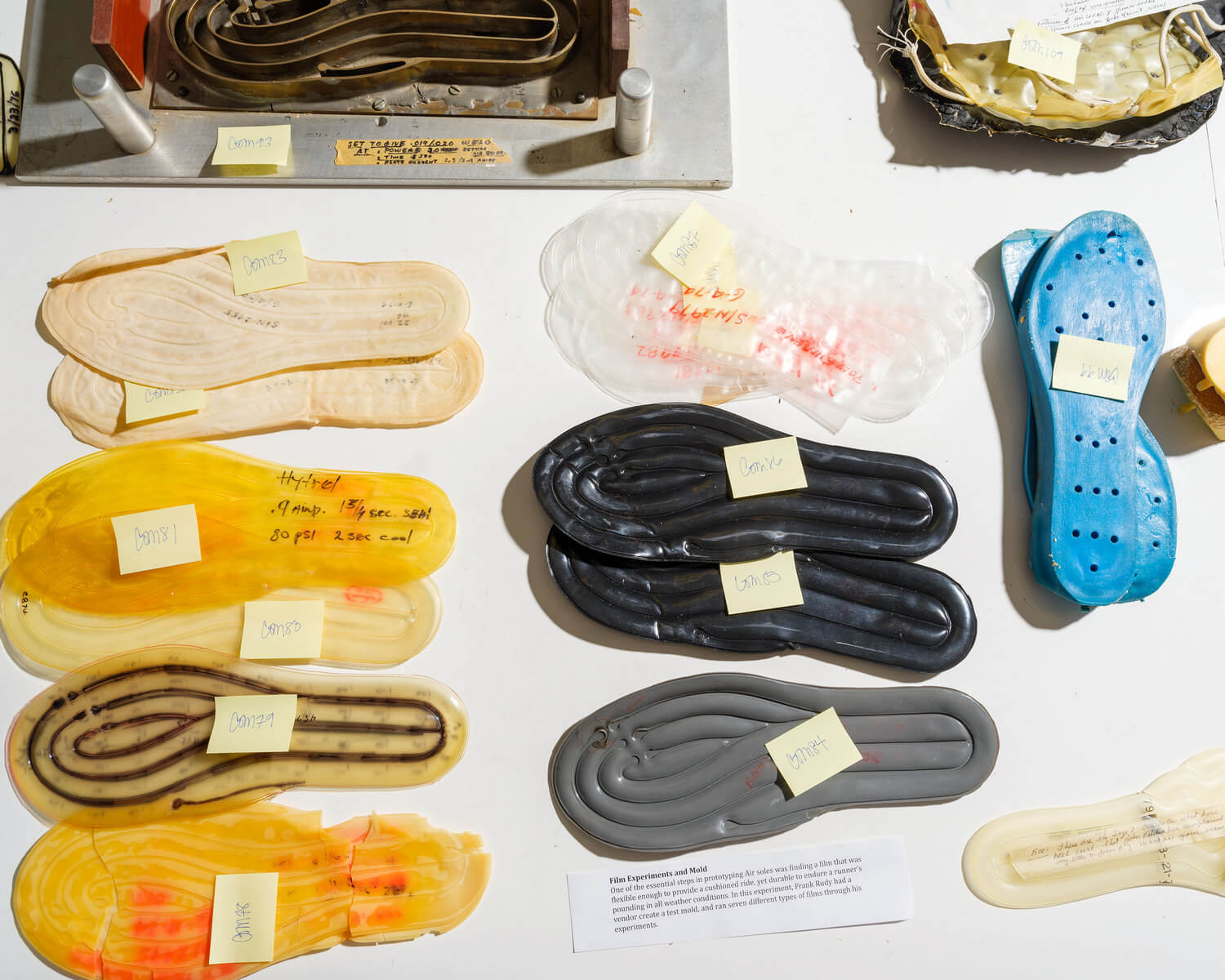 Tabletop covered with objects from Frank Rudy who invented the Air Technology, Department of Nike Archives (DNA), Beaverton, Oregon, 2024 © Nike, Inc., photo: Alastair Philip Wiper